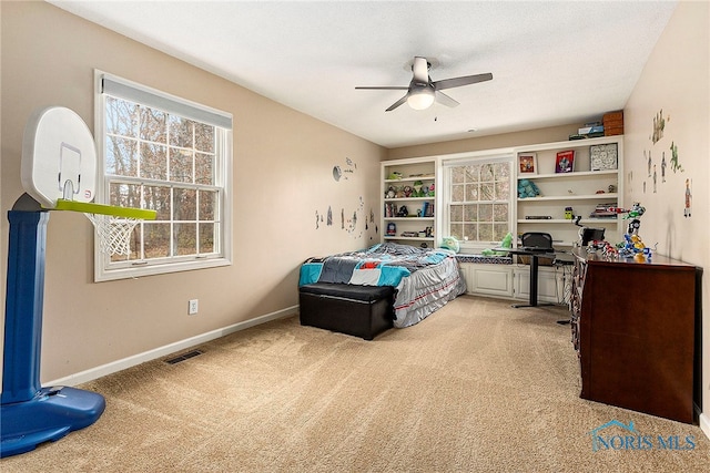 bedroom featuring light colored carpet and ceiling fan