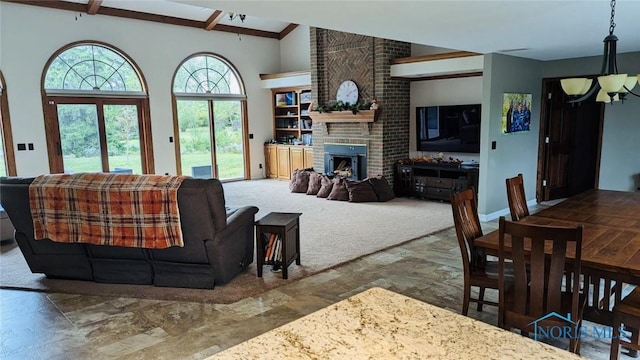 living room with a brick fireplace and carpet