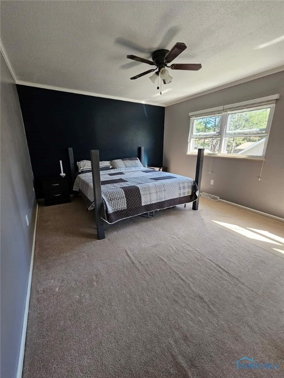 bedroom with carpet, a textured ceiling, ceiling fan, and ornamental molding