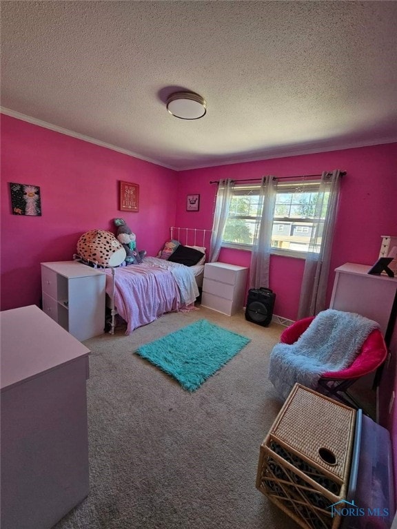 carpeted bedroom with a textured ceiling and ornamental molding