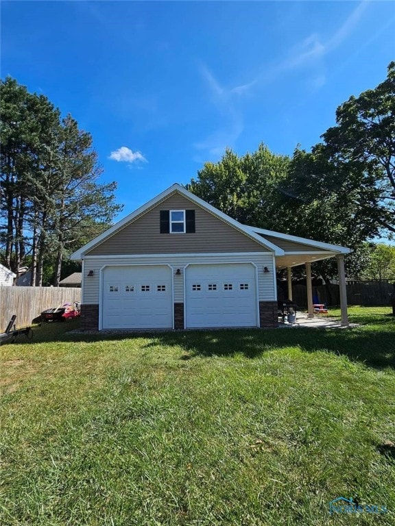 garage featuring a yard