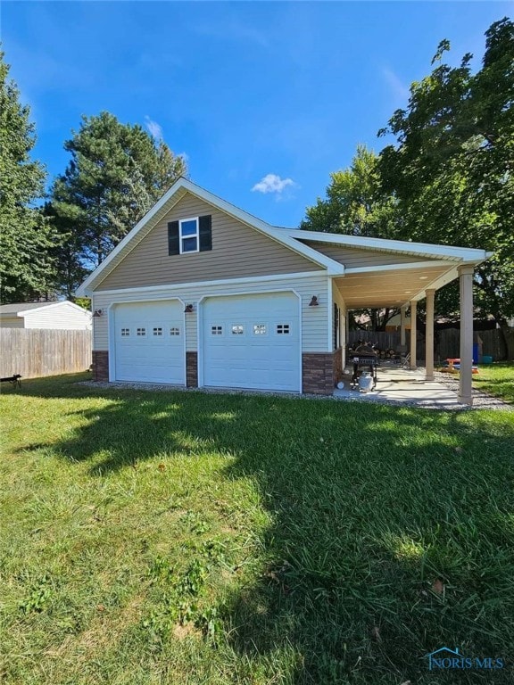 garage featuring a yard