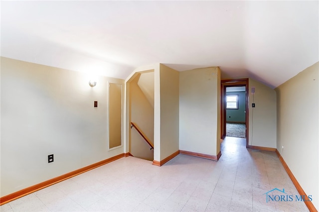 bonus room featuring vaulted ceiling