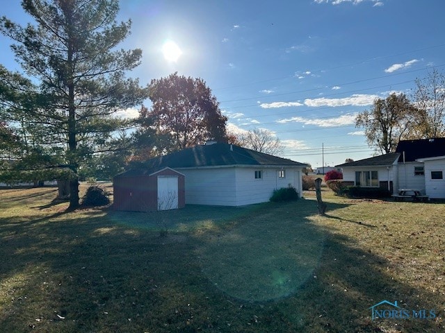 exterior space featuring a shed and a lawn