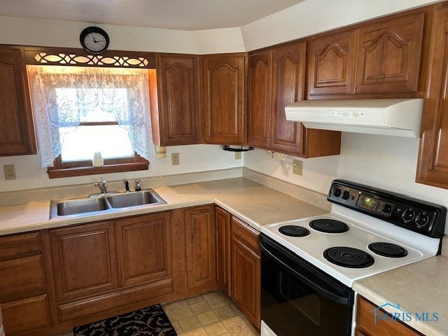 kitchen with white electric range and sink