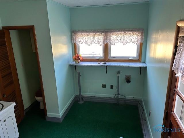 1811 E Wilson, Bryan, OH 43506 - washroom with dark colored carpet and baseboards