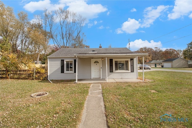 view of front of house featuring a front yard and a porch