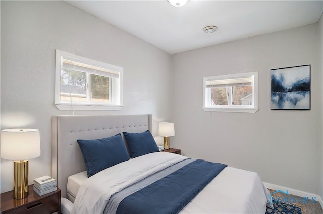 bedroom featuring multiple windows