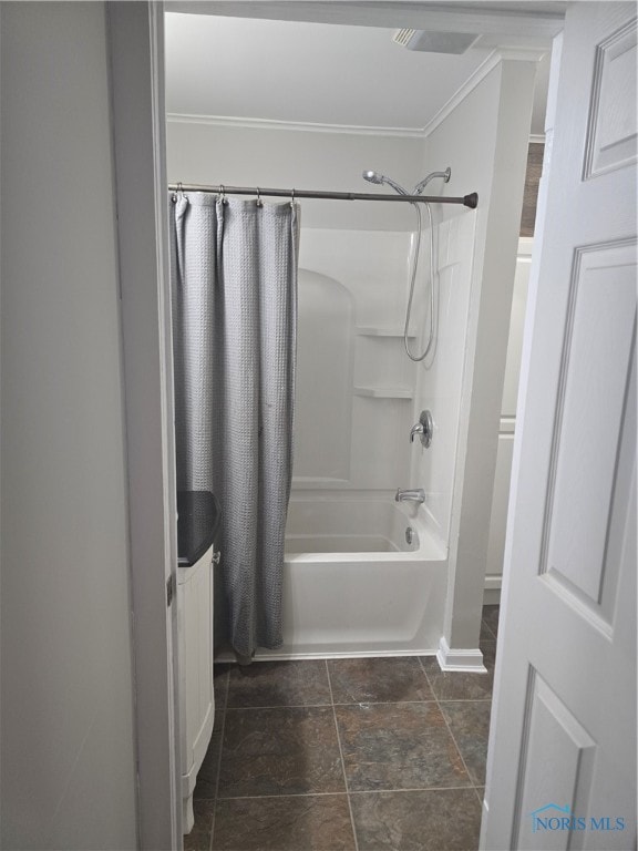 bathroom with shower / bath combo with shower curtain and ornamental molding