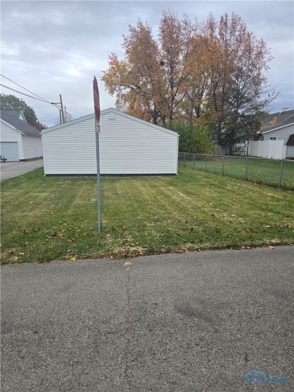 view of property exterior with a lawn