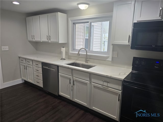 kitchen featuring white cabinets, black appliances, and sink