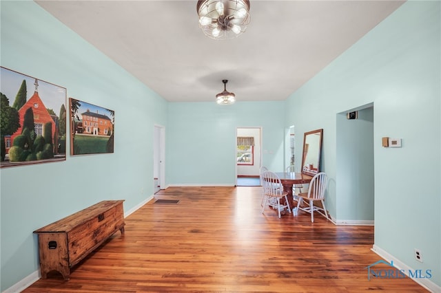 interior space with hardwood / wood-style floors and a chandelier