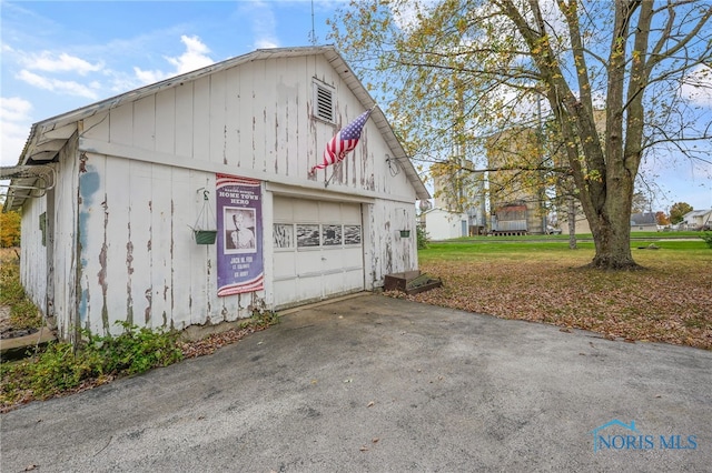 garage featuring a yard