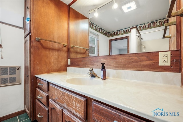 bathroom with vanity, rail lighting, and tile patterned flooring