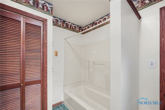 bathroom featuring  shower combination and tile patterned floors