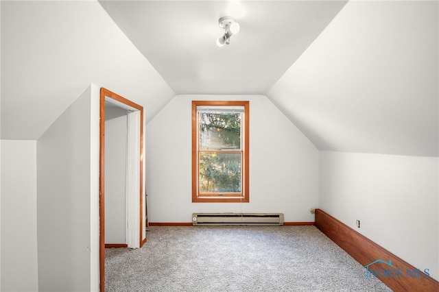 bonus room featuring carpet floors, baseboard heating, and vaulted ceiling