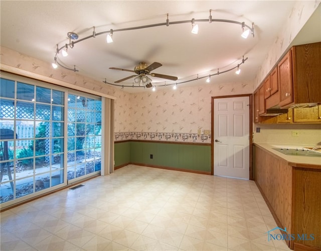 interior space featuring ceiling fan