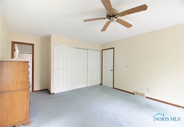 unfurnished bedroom with a closet and ceiling fan