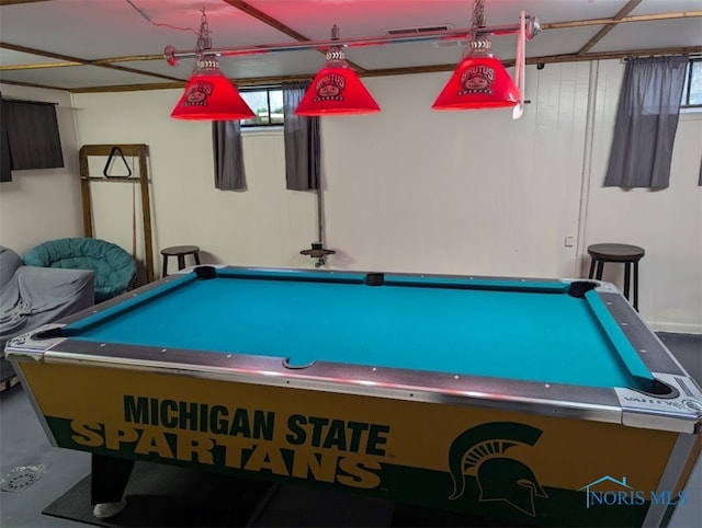 game room featuring concrete floors and plenty of natural light