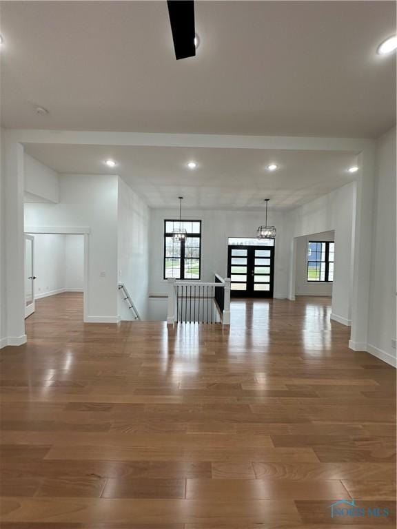 3640 Turtle Creek Dr, Perrysburg, OH 43551 - unfurnished room with a chandelier, wood finished floors, recessed lighting, plenty of natural light, and baseboards