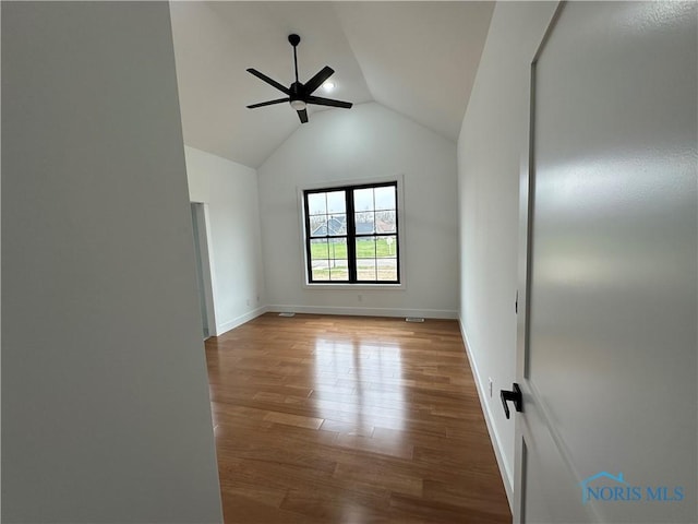 3640 Turtle Creek Dr, Perrysburg, OH 43551 - unfurnished room with ceiling fan, vaulted ceiling, wood finished floors, and baseboards