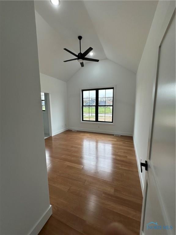 3640 Turtle Creek Dr, Perrysburg, OH 43551 - spare room with ceiling fan, lofted ceiling, wood finished floors, baseboards, and recessed lighting