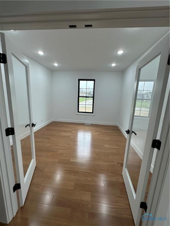 3640 Turtle Creek Dr, Perrysburg, OH 43551 - unfurnished room featuring french doors, wood finished floors, baseboards, and recessed lighting