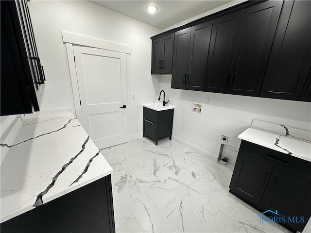 3640 Turtle Creek Dr, Perrysburg, OH 43551 - laundry room with cabinet space, hookup for a washing machine, baseboards, light marble finish floors, and hookup for an electric dryer