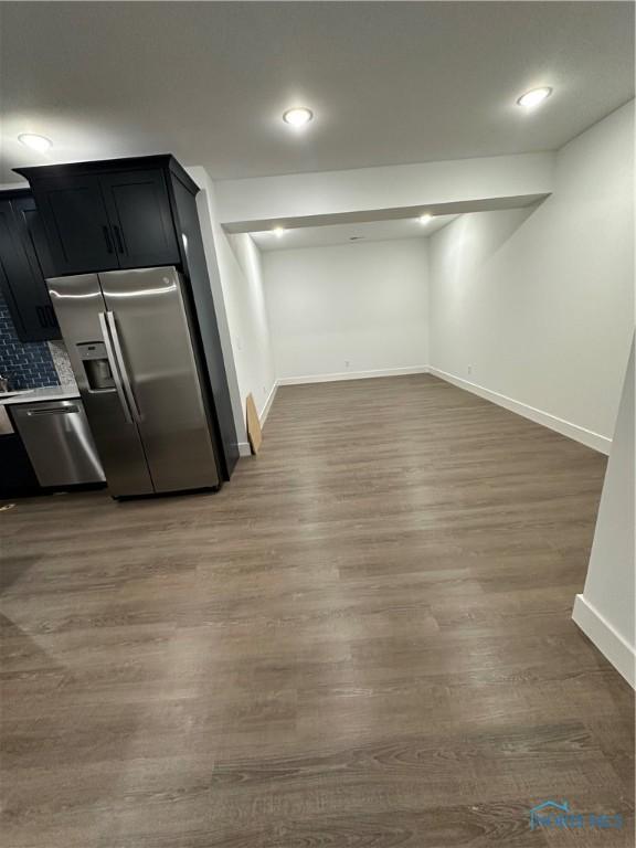 3640 Turtle Creek Dr, Perrysburg, OH 43551 - below grade area featuring stainless steel fridge with ice dispenser, baseboards, wood finished floors, and recessed lighting