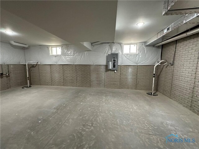 3640 Turtle Creek Dr, Perrysburg, OH 43551 - below grade area featuring electric panel and brick wall