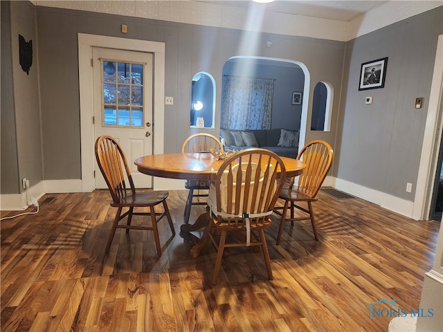 dining space featuring hardwood / wood-style flooring