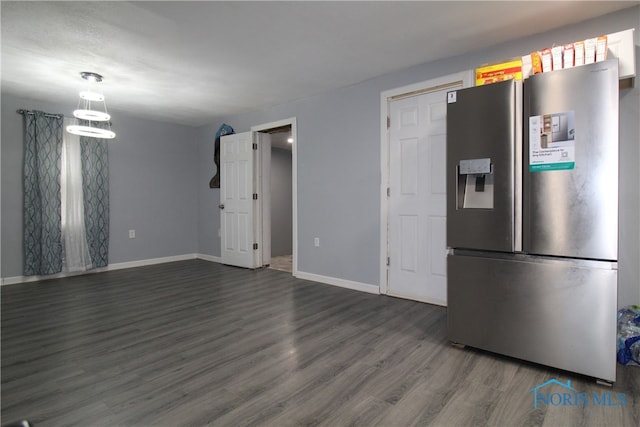 kitchen with stainless steel refrigerator with ice dispenser and dark hardwood / wood-style floors