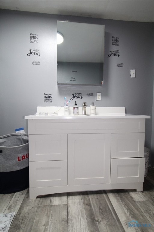 bathroom with vanity and hardwood / wood-style flooring