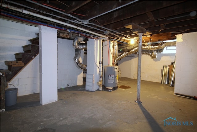 basement featuring electric water heater and heating unit