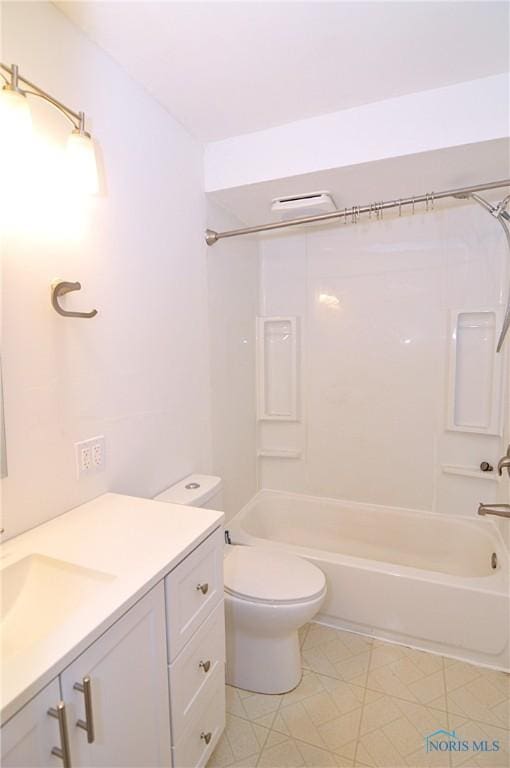 full bathroom with vanity, washtub / shower combination, and toilet