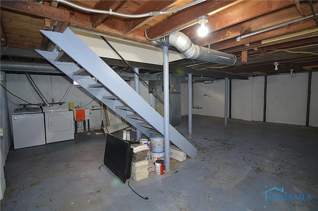 basement with sink and washer and dryer