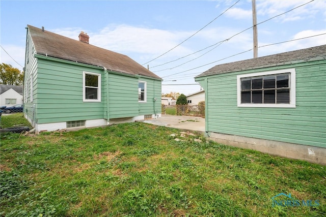 exterior space featuring a yard and a patio area