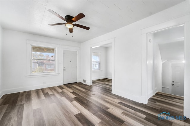 interior space featuring dark hardwood / wood-style flooring, a healthy amount of sunlight, and ceiling fan