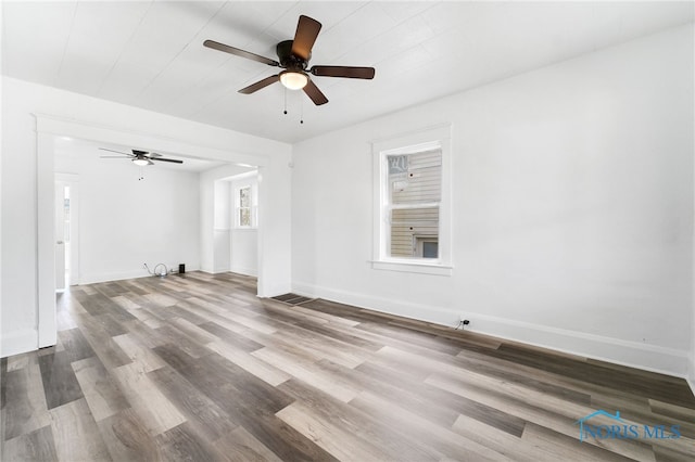 spare room featuring hardwood / wood-style floors and ceiling fan