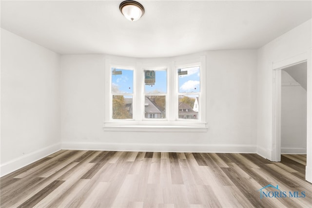 509 Utah St, Toledo, OH 43605 - spare room featuring wood finished floors and baseboards