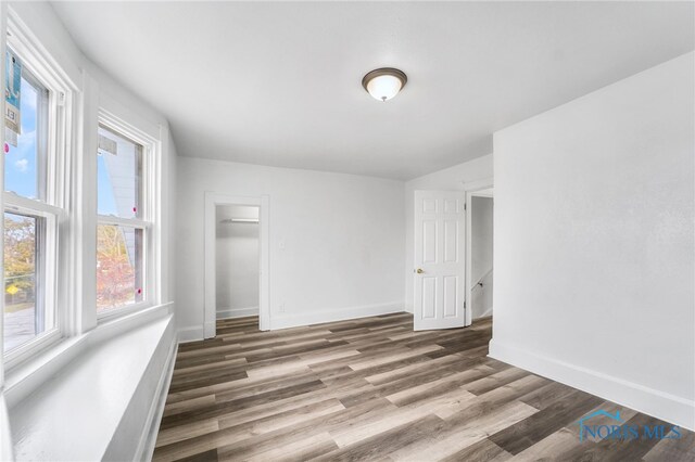 509 Utah St, Toledo, OH 43605 - unfurnished bedroom featuring a closet, wood finished floors, and baseboards