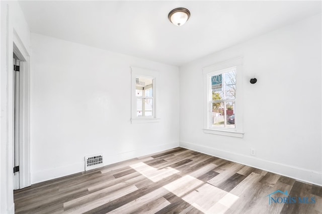 unfurnished room featuring wood-type flooring