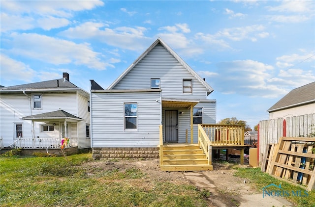 509 Utah St, Toledo, OH 43605 - back of property with fence and a wooden deck