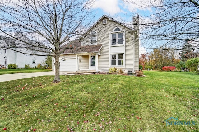 view of front property featuring a garage and a front yard