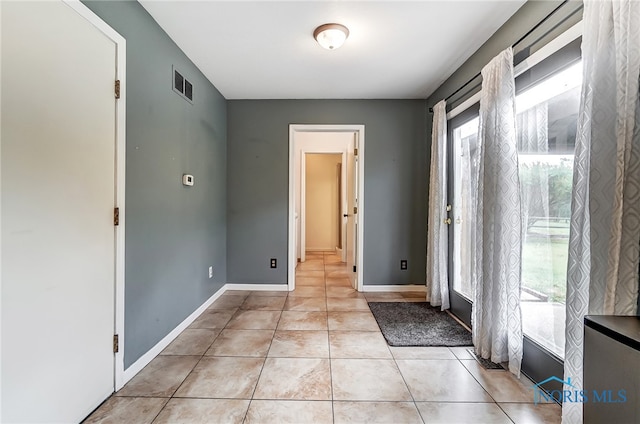 interior space featuring light tile patterned floors