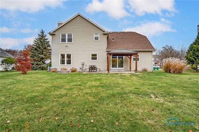 back of house with a lawn, a patio, and a gazebo