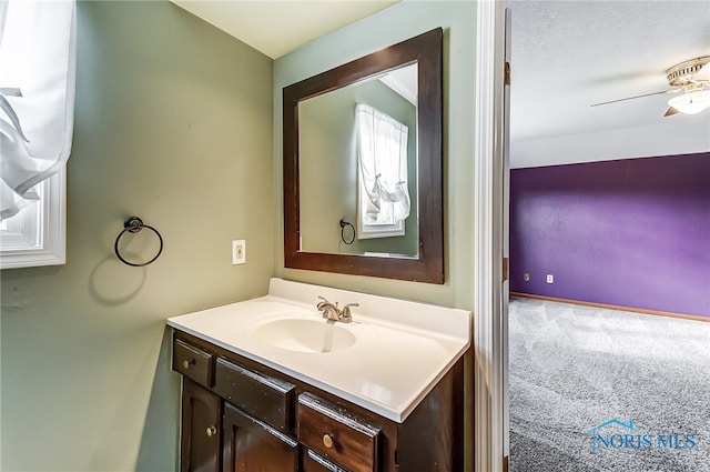 bathroom featuring vanity and ceiling fan