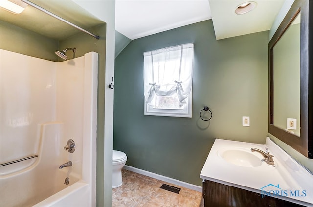 full bathroom featuring shower / bath combination, vanity, toilet, and lofted ceiling