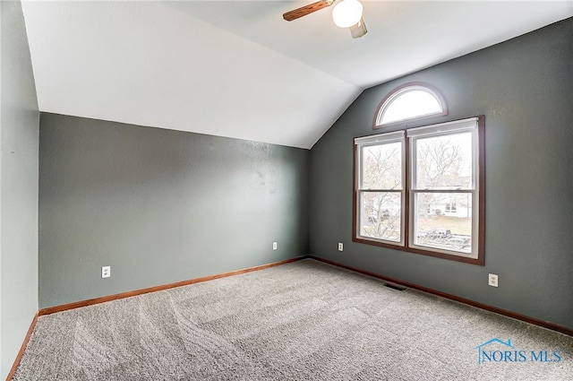 bonus room featuring ceiling fan, lofted ceiling, and carpet