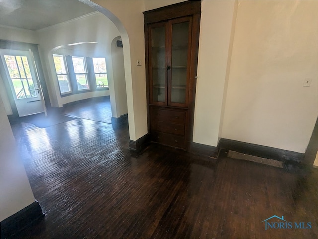 spare room with dark wood-type flooring